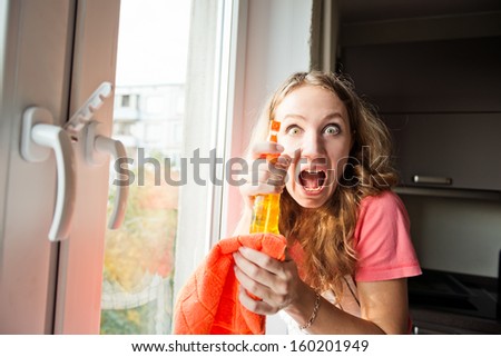 crazy woman housewife washes a window