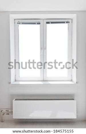White plastic double door window with radiator under it. Domestic room. Isolated window aperture