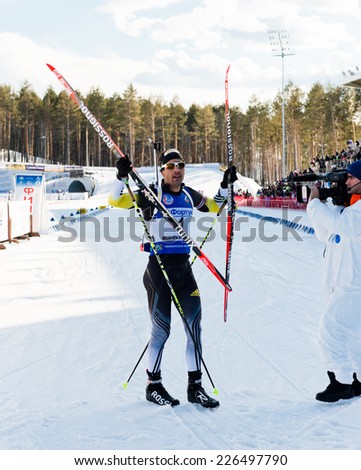 Tyumen, RUSSIA - APR 9, 2014: Martin Fourcade (FRA) after finish at Biathlon Men\'s 18 km Mega Mass start at International Biathlon Competition \