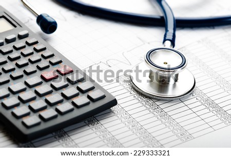 Health care costs. Stethoscope and calculator symbol for health care costs or medical insurance