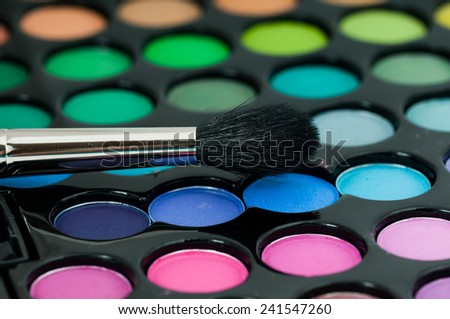 Professional eye shadows palette with makeup brushes. Makeup background