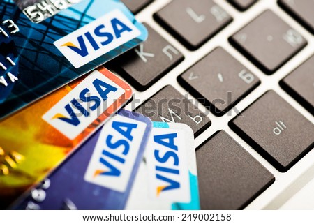 YEKATAERINBURG, RUSSIA - JAN 07, 2015:  Shopping on the Internet - Visa card on the notebook keyboard. Visa is biggest credit card companie in the world.