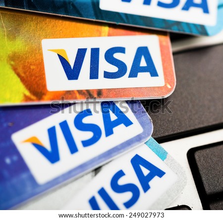 YEKATAERINBURG, RUSSIA - JAN 07, 2015:  Shopping on the Internet - Visa card on the notebook keyboard. Visa is biggest credit card companie in the world.