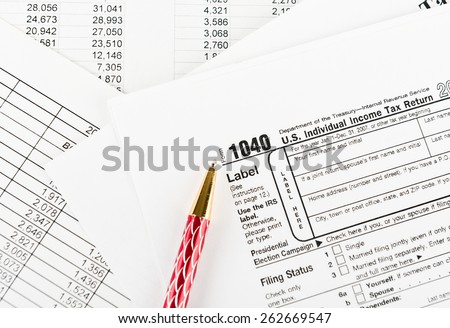 Tax form 1040  for US individual tax return with pen