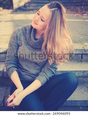 Young woman with fluttering hair. Instagram style filtred image