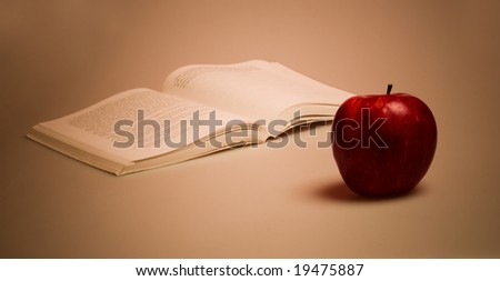 A red apple and book