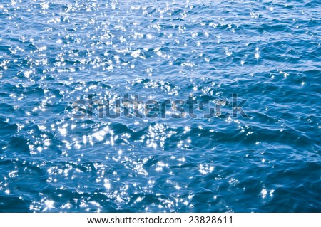 Ocean water sparkling in bright morning sun