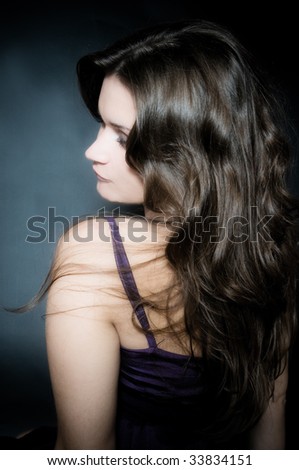 Beautiful female curly long hairs - back view