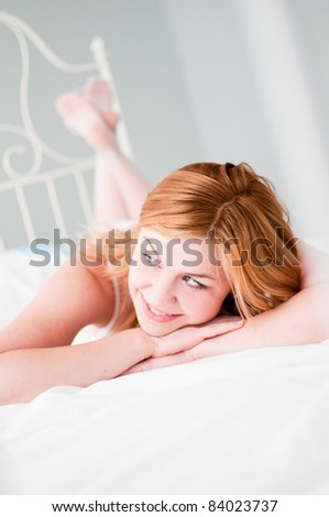 woman on the bed looking up