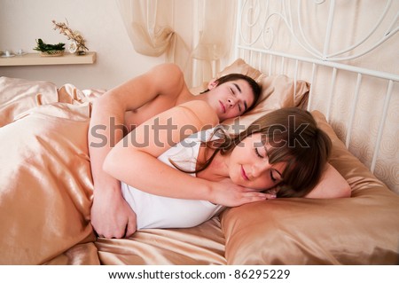 Young couple sleeping in a bed