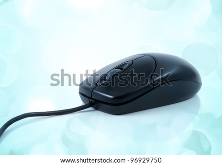 black mouse with lights in the background