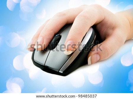 computer mouse with hand  with blue lights in the background