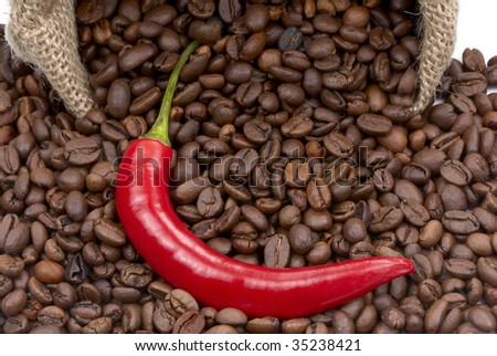 Coffee beans and red chilly peppers. Macro