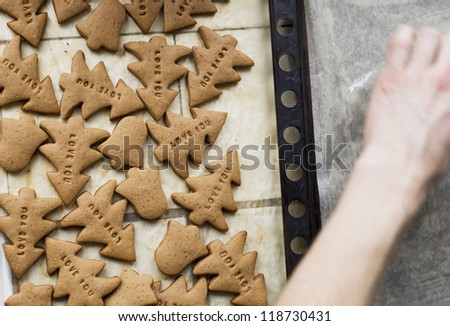 The process of making cookies. Sweet cookies christmas tree and bell with inscription love you.