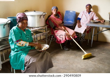 HOEDSPRUIT, SOUTH AFRICA - APRIL 17: Cooks from a school in a small township near Kruger park at rest after lunch, on April 17, 2015 in Hoedspruit, South Africa