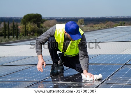 worker polishing the panels in a plant