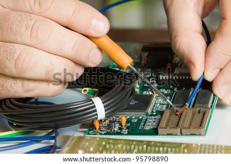 electrician, details of hands working on small appliances