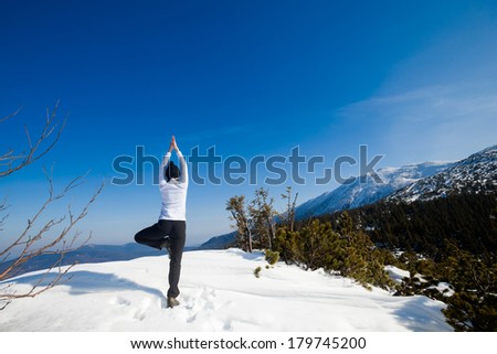 Winter yoga session in beautiful place - Beskid mountains, Poland. Babiagora National Park