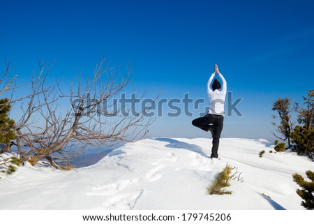 Winter yoga session in beautiful place - Beskid mountains, Poland. Babiagora National Park