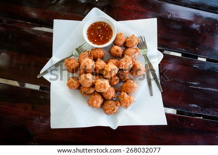 Fresh fried thai no name meatballs served with sweet chilli sauce. Traditional asian cuisine.