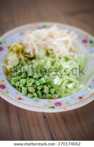 Selection of fresh vegetables - bean sprouts, bean, cabbage and pickle Traditional thai cuisine.
