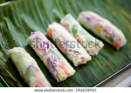 Fresh made spring rolls Poh Pia Sod. Traditional thai cuisine served on banana leaf