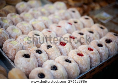 Fresh made donuts Pa Thong Ko stuffed with colofrul filling. Traditional thai dessert.
