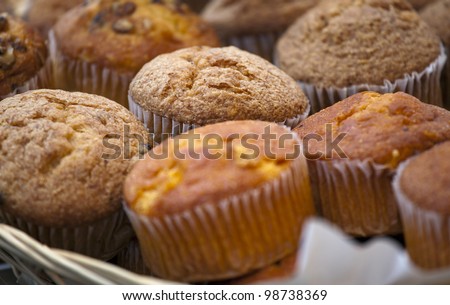 Group of delicious muffins cakes on a cake shop