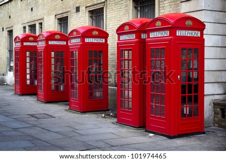 Row of old style UK red phone boxes in Covent Garden, London