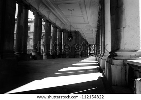 Black and white photograph of the sunlit corridor Royal Naval College Greenwich London England United Kingdom Europe UK