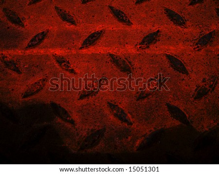Dark red shadow cast on rusty metalwork abstract background with diagonal grid shape pattern
