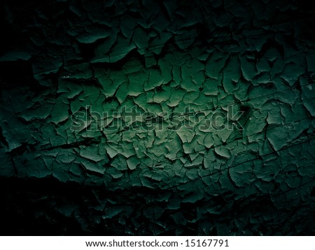 Dark shadow around green cracked wooden background
