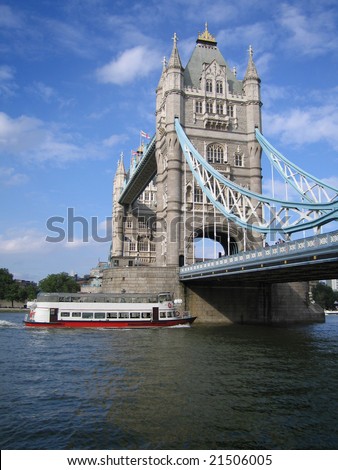 London Bridge over the River Thames with cruise boat, London England UK