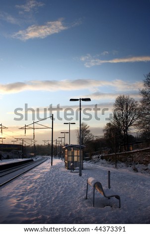 Snow covered train platform early morning