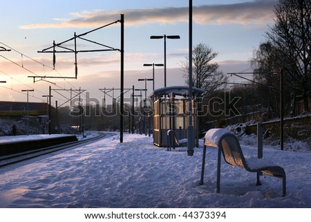 Snow covered train platform early morning