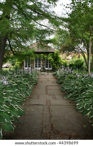 Cottage at the end of hosta lined path