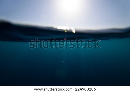split underwater and sky background with sun rays