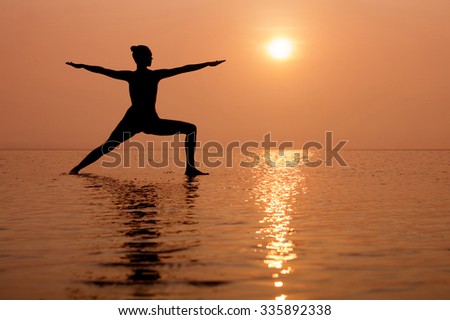 Yoga on the beach at sunset. Different correct asanas set in my portfolio