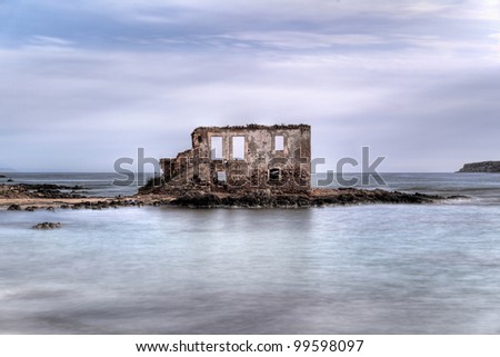 The ruins of a house in the middle of the sea in the village Plytra in the Southern Peloponnese, Greece