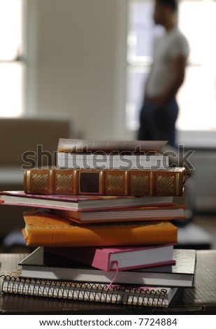 All kinds of books lying on a table