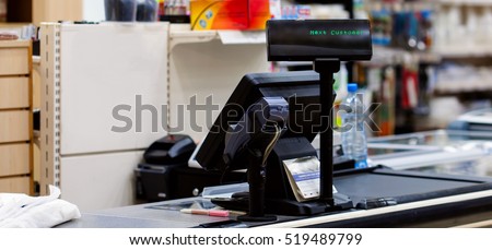 Empty cash desk with terminal in supermarket