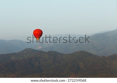 colorful red hot air balloon in sky of Laos