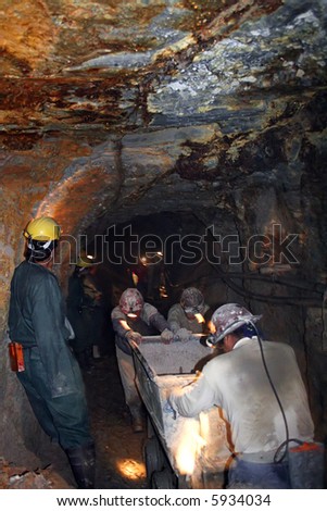 Mining - Miners pushing a tram through a silver mine.\
\
(Please see other images in this series)