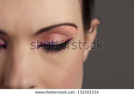 Woman with graphic pink makeup
