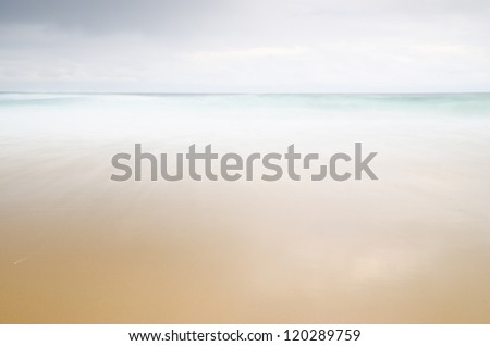 Ocean texture. Long exposure photo, sand and water, beach and sea texture