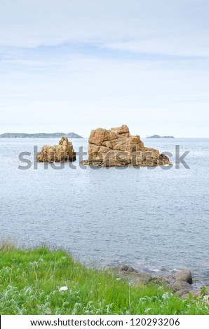 Rocks on the sea, beautiful ocean landscape. Scenic stretch of Pink Granite Coast coastline, France