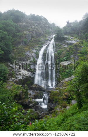 Mountain Waterfall . A gorgeous waterfall nestled in a Spanish forest. The name of the cascade es \