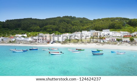 Fishing village. Spanish fishing village. Beautiful landscape with transparent turquoise sea and lots of colorful boats.