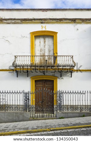 Colorful house. Colorful windows and facade in Sevilla, Spain. Ancient facade