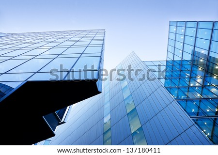 Modern buildings, skyscrapers. Office buildings against the cloudy blue sky. Skyscrapers view with blue sky